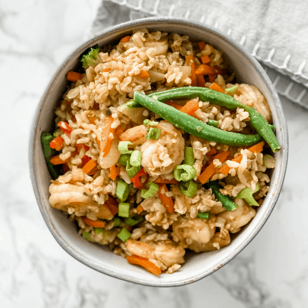 shrimp, vegetables, and rice in a bowl