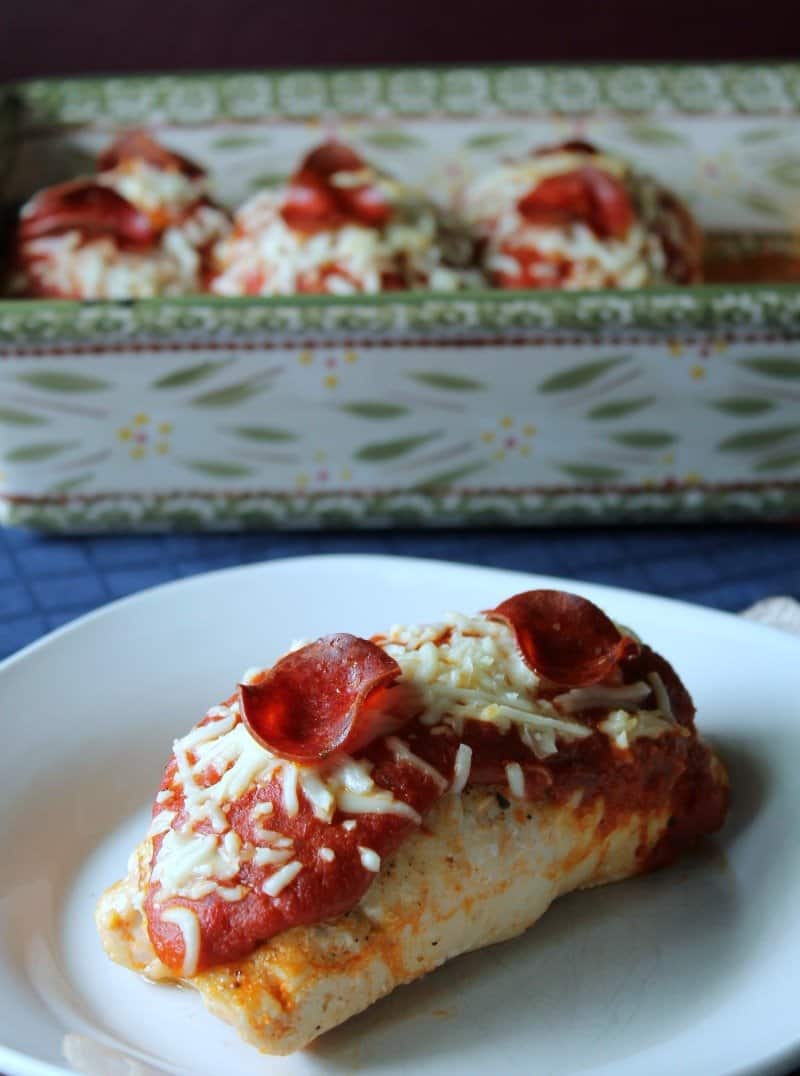 pizza chicken breast on a white plate 