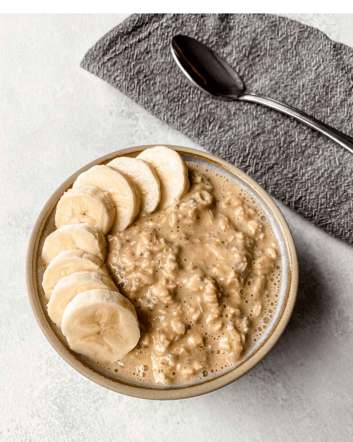overnight oats with pb2 in a bowl with bananas