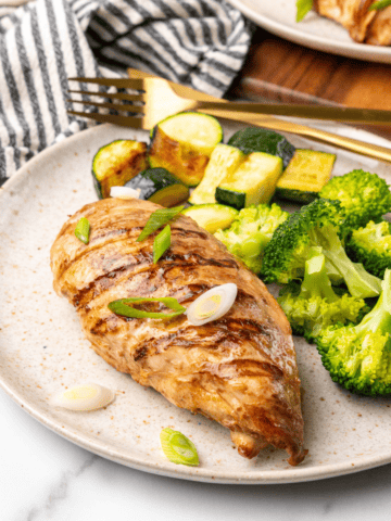 front picture of the grilled asian chicken on a plate.