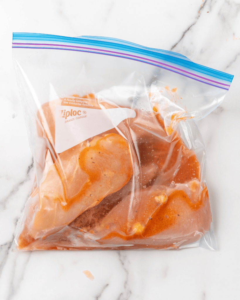 chicken in marinade in a bag.