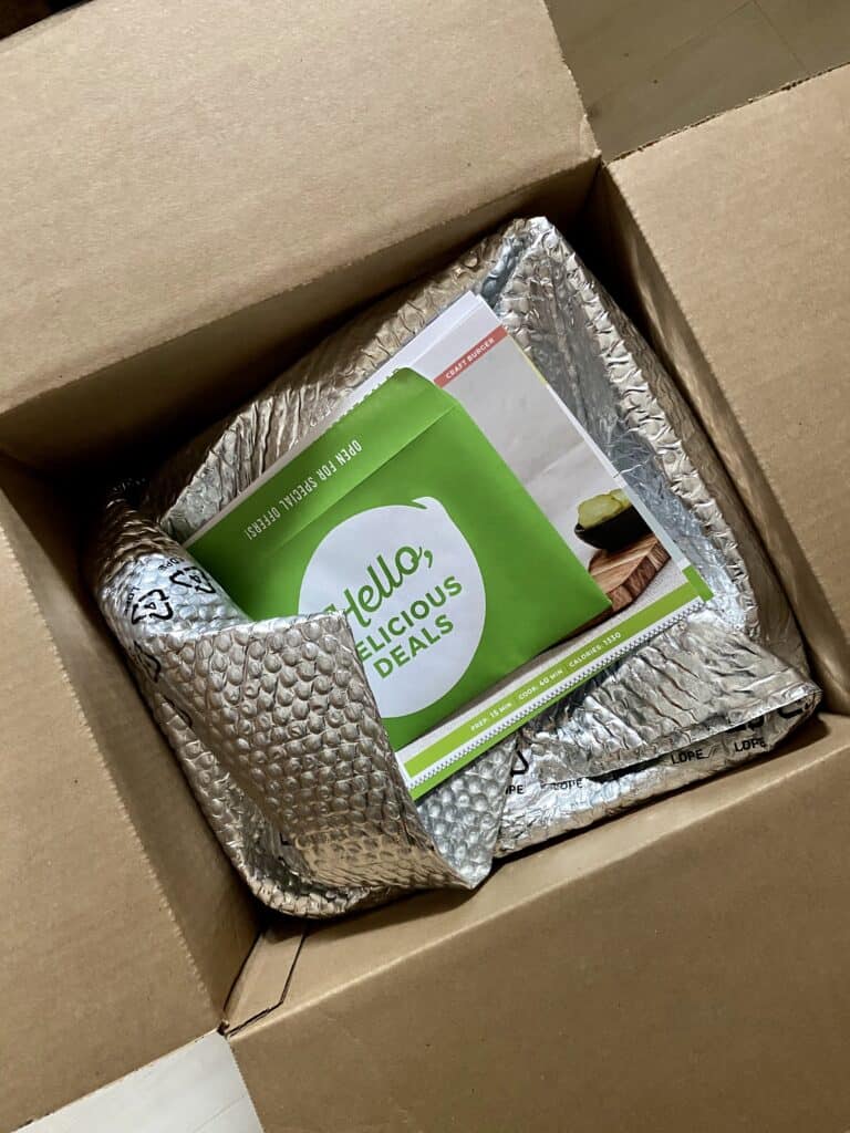 box of fresh ingredients and recipe cards
