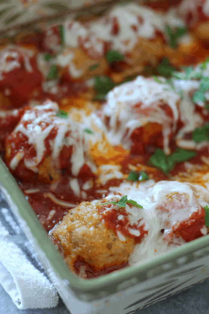 close up picture of chicken parmesan meatballs.