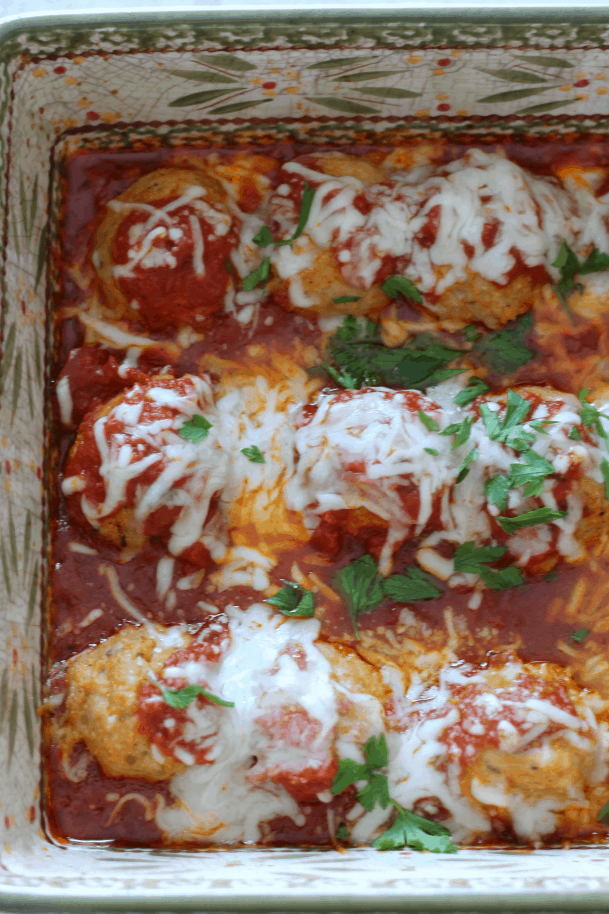 chicken parmesan meatballs cooked with melted cheese