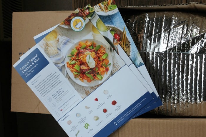 blue apron recipe cards on the box.