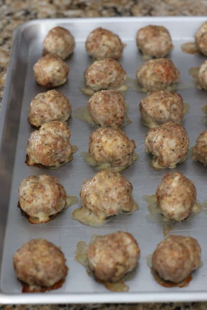 baked turkey meatballs on a sheet pan.