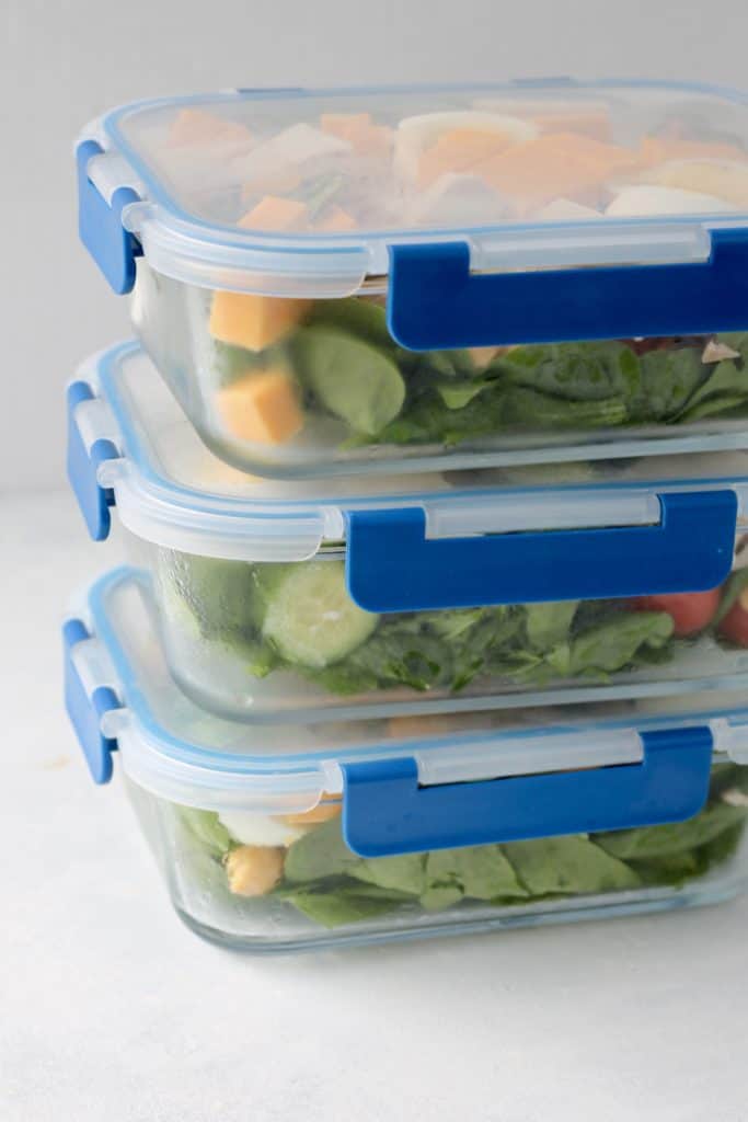 glass meal prep containers with salad