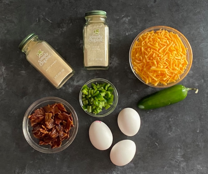 Ingredients for jalapeno cheddar egg bites - eggs, spices, bacon, cheddar, jalapeno 