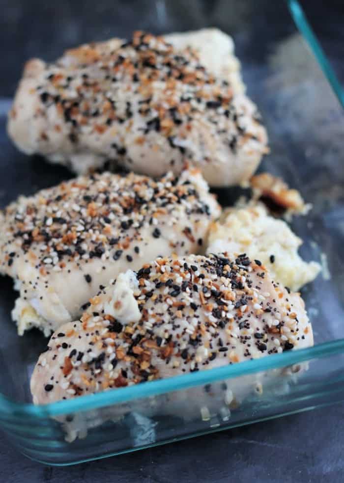 Make ahead keto stuffed chicken in a glass container.