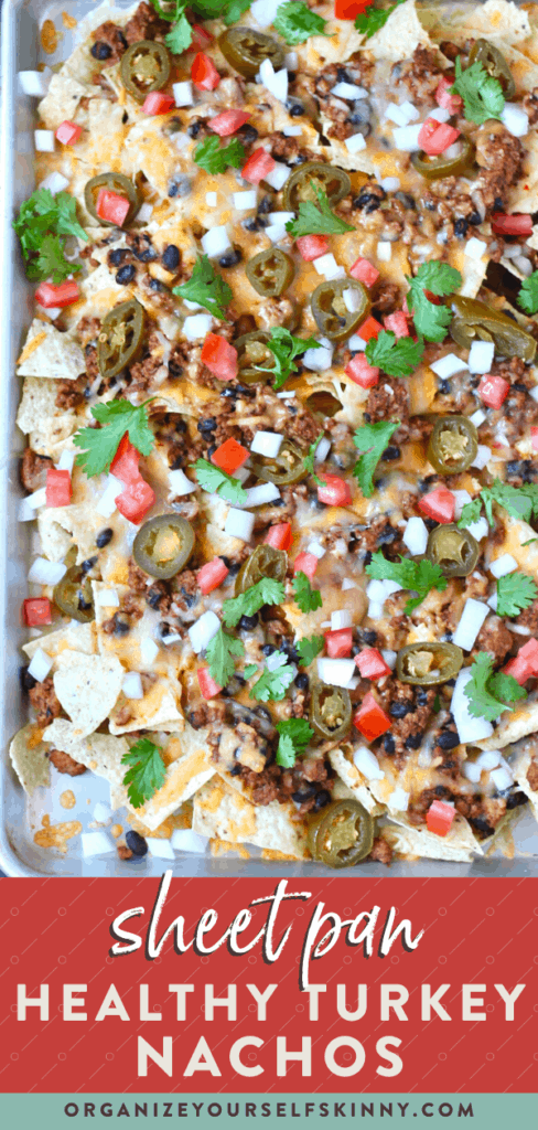 Sheet pan nachos with turkey meat, pico de gallo and jalapeño slices.