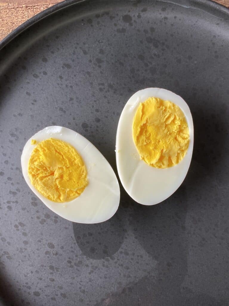 Halved hardboiled eggs on a plate