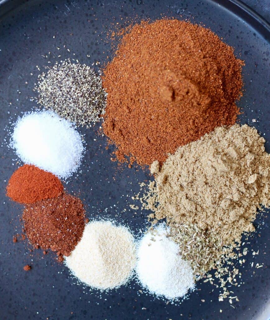 Spices needed to make homemade taco seasoning for use in nachos.