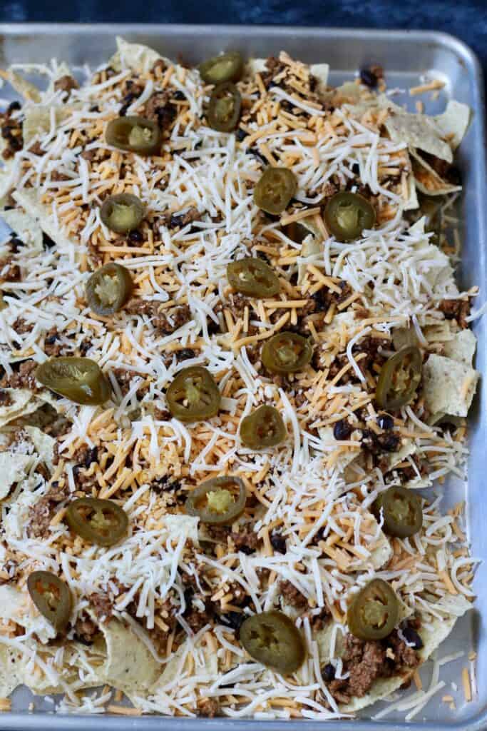 Sheet pan nachos with ground turkey prior to going in the oven.