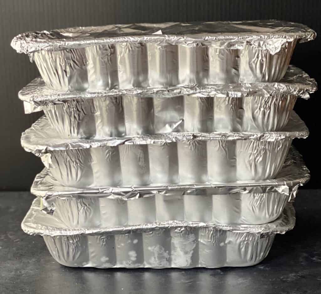 Stack of freezer casseroles ready to cook