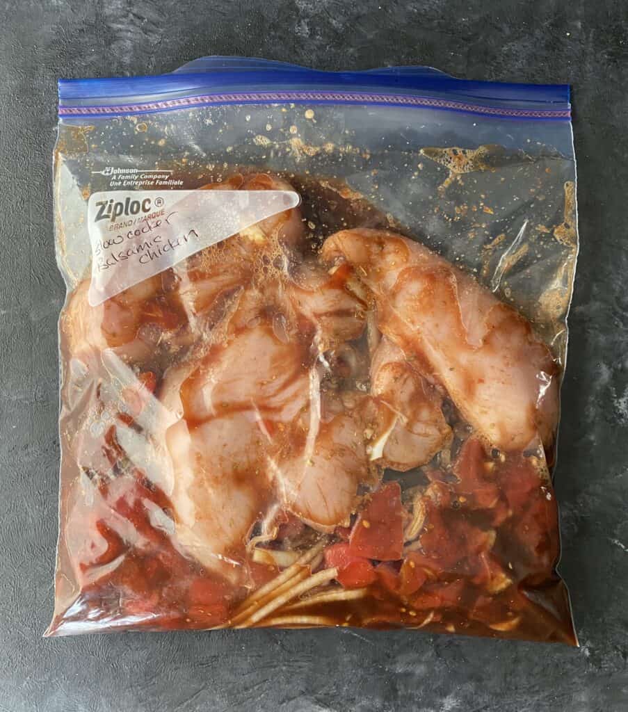 Slow cooker balsamic chicken prepped for being frozen in a ziploc bag