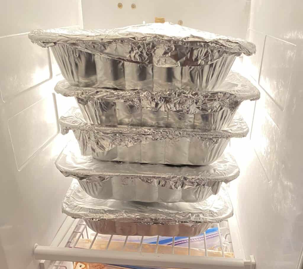 Stack of freezer casseroles in a freezer