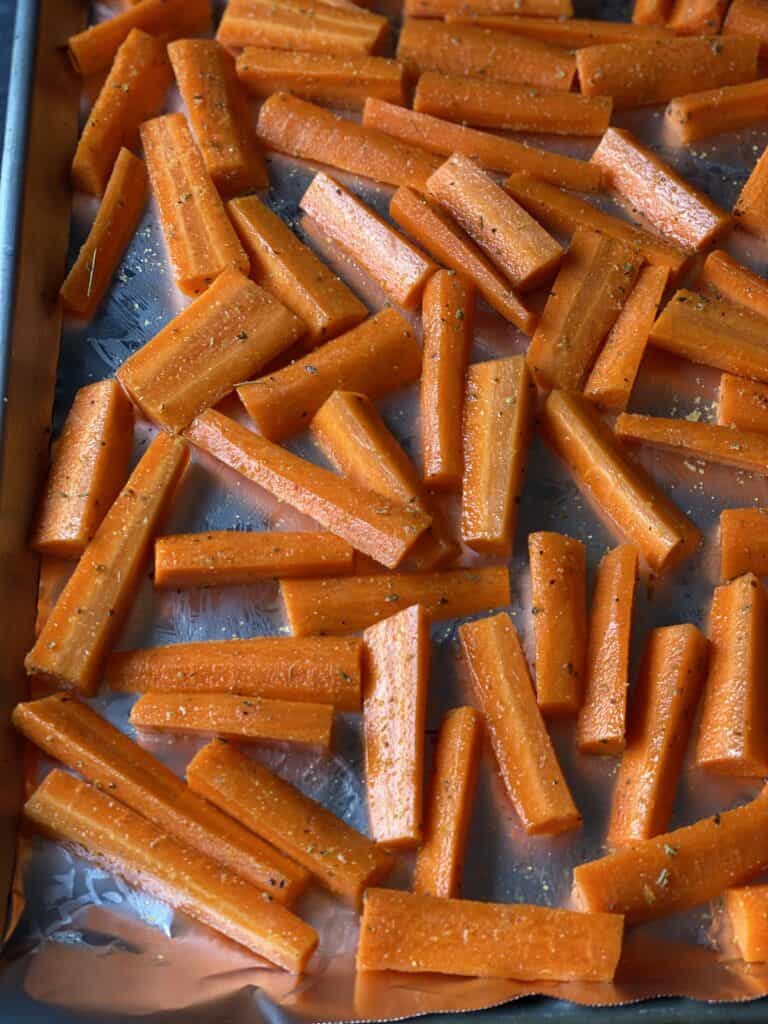 seasoned roasted carrots on sheet pan 