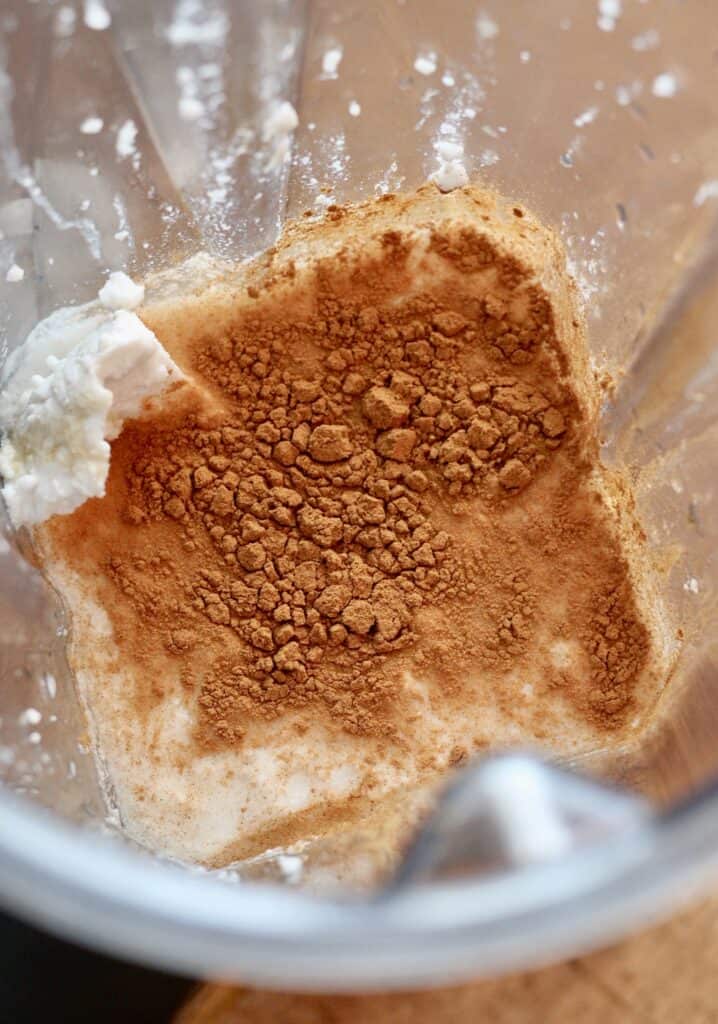 Ingredients for a homemade coffee creamer in a blender.