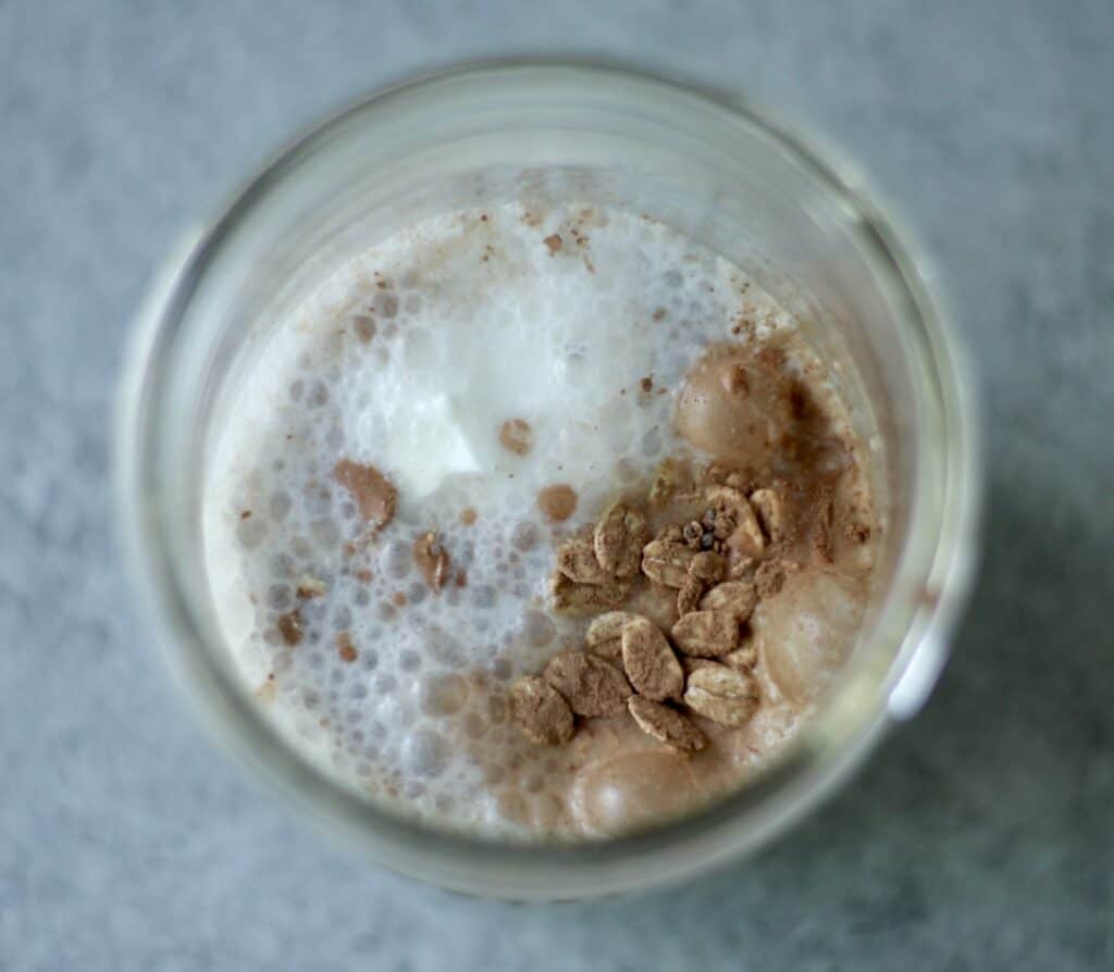 Chocolate overnight oats with yogurt in a mason jar