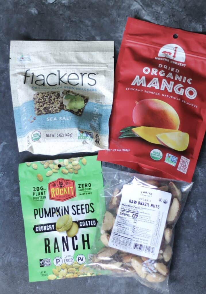 Flackers, dried mango, pumpkin seeds, and raw brazil nuts