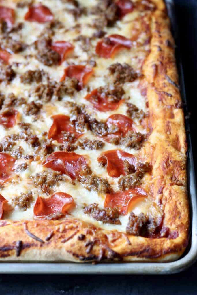 sheet pan pizza with pepperoni and turkey sausage