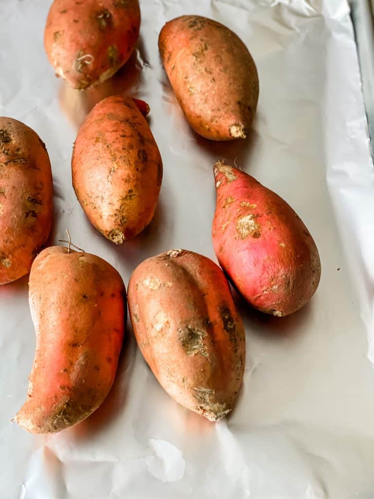 roasted sweet potatoes on a sheet pan