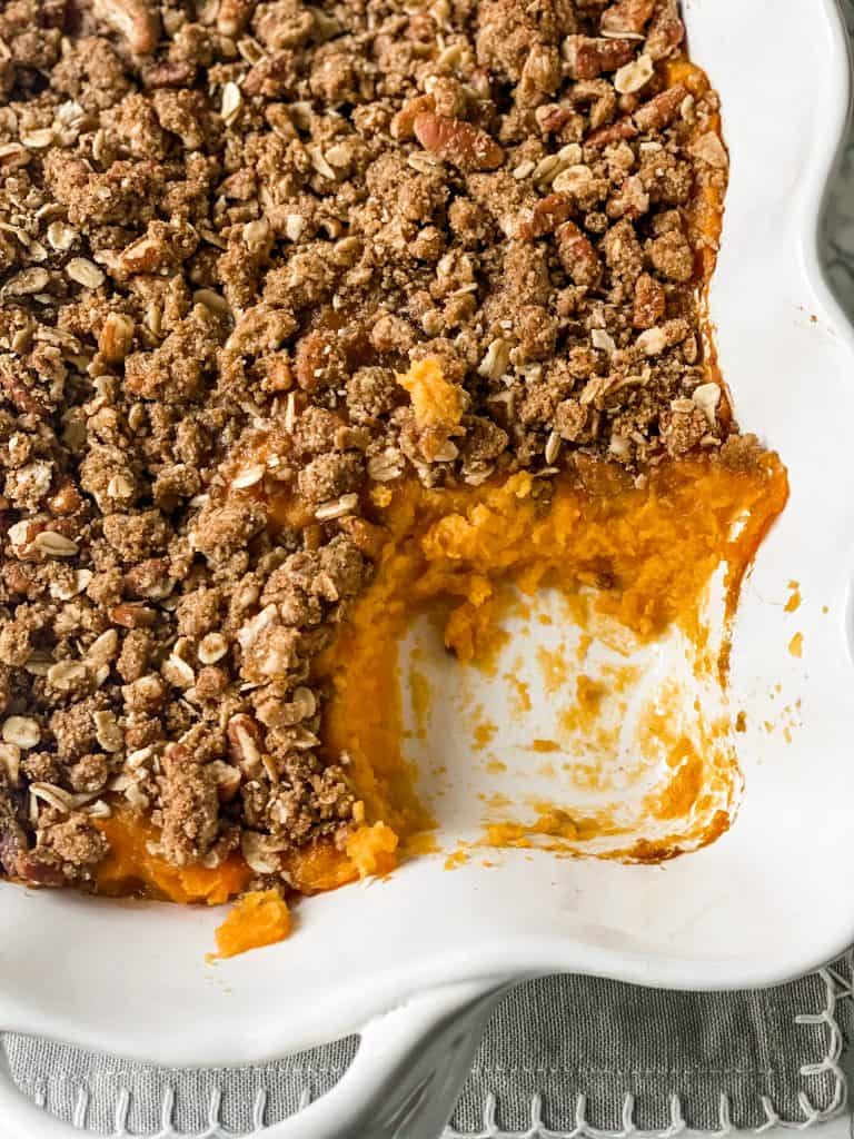 cooked sweet potato casserole with a portion taken out