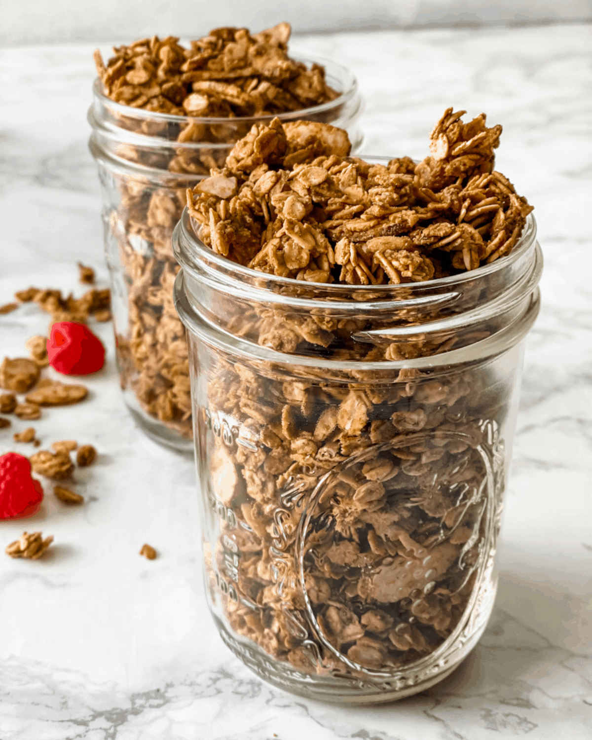 cooked almond butter granola in mason jars