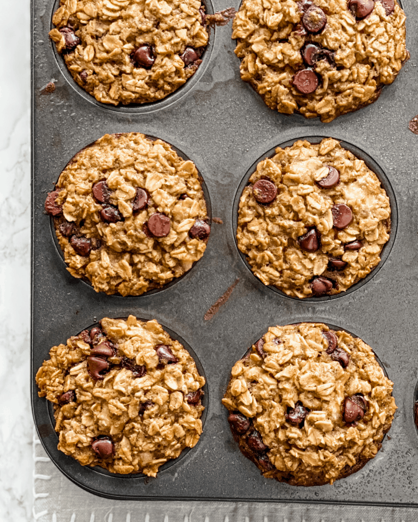 baked banana chocolate chip oatmeal cups in a muffin pan