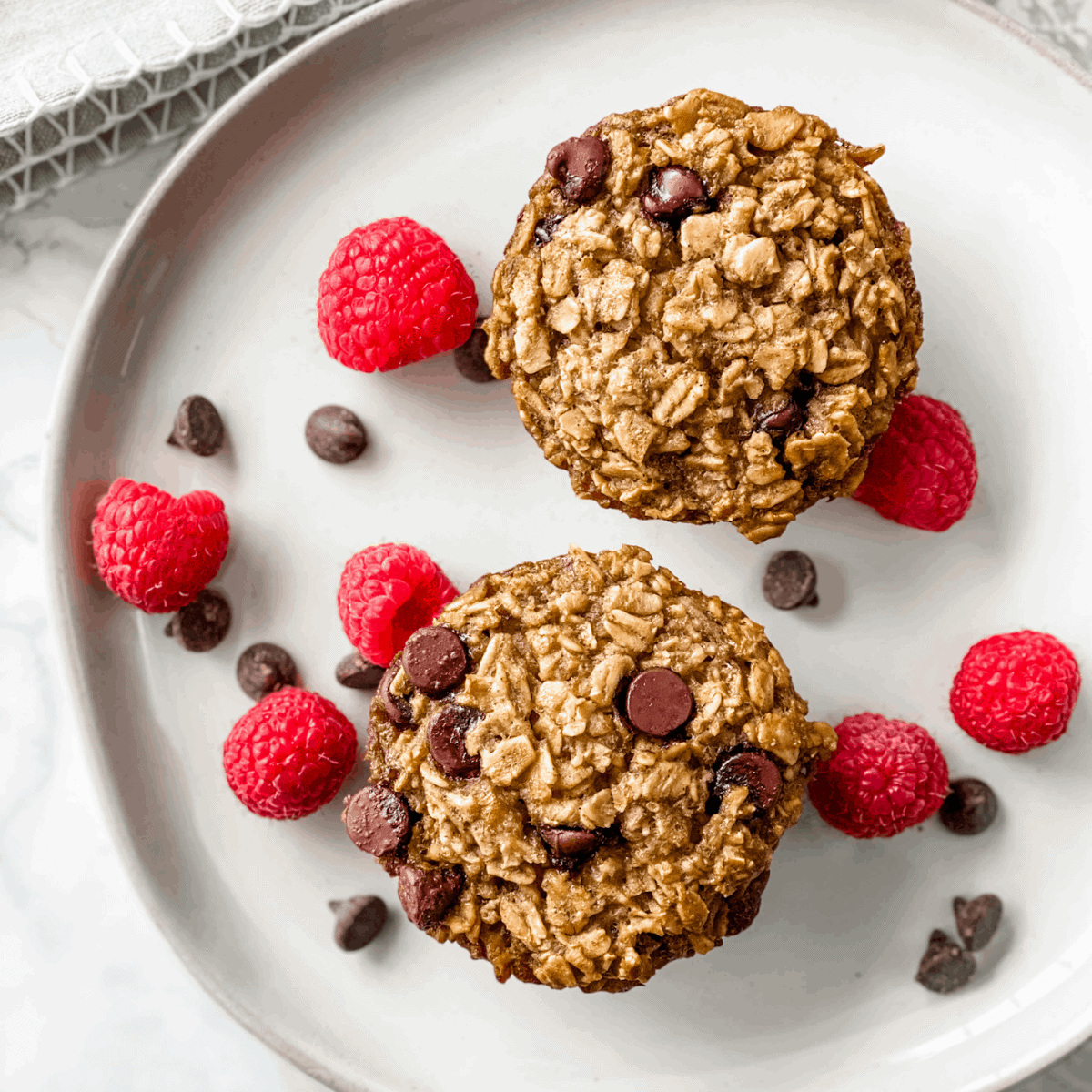 chocolate chip banana baked oatmeal with berries on a plate