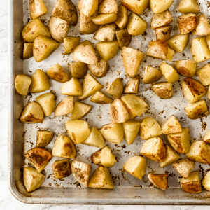 crispy oven roasted potatoes on a baking sheet