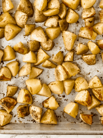 crispy oven roasted potatoes on a baking sheet