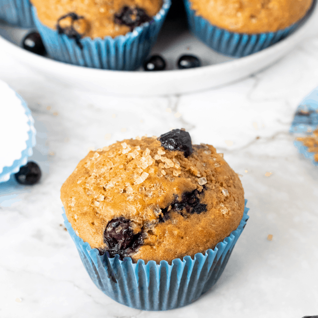 healthy blueberry muffins with Turbinado sugar sprinkled on top.