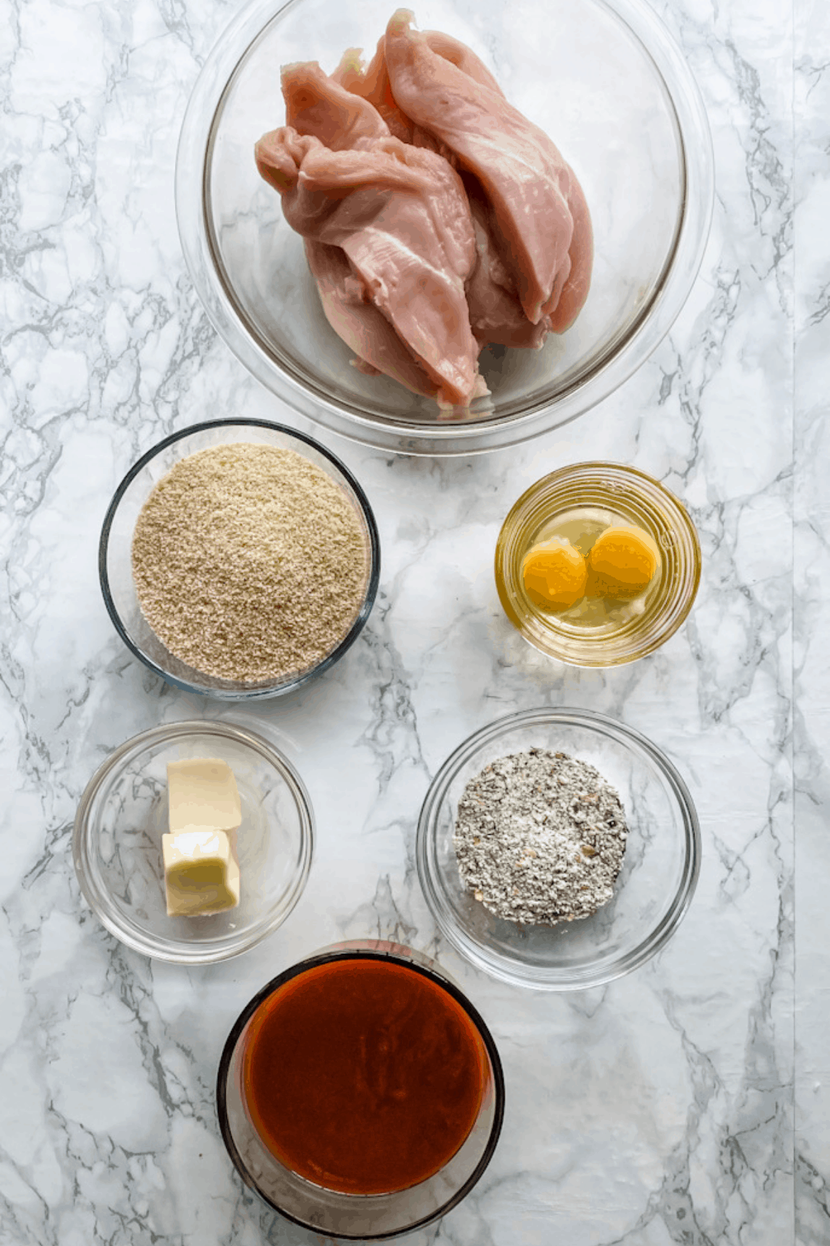 The ingredients to make baked buffalo chicken tenders.