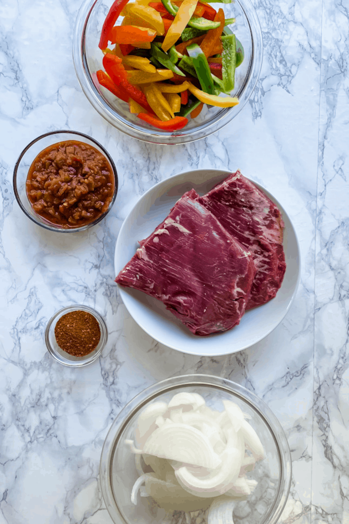 All the ingredients needed to make crockpot steak fajitas.