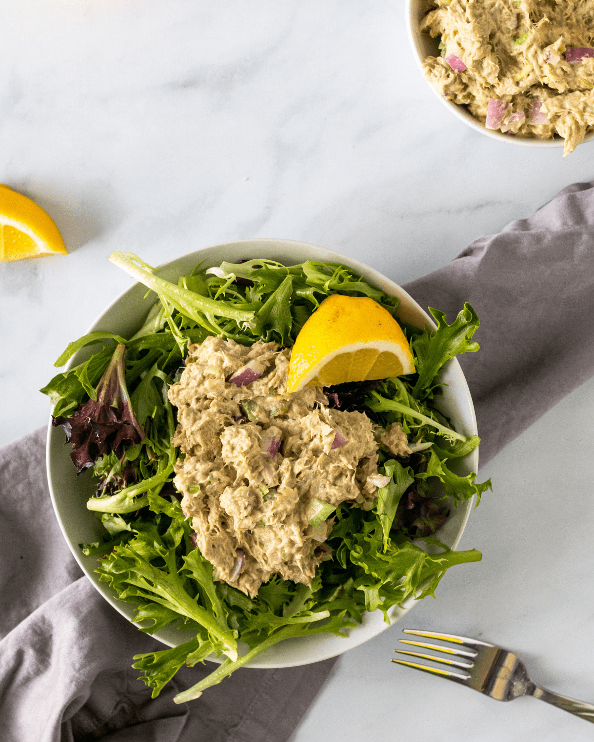 healthy tuna salad on a bed of greens