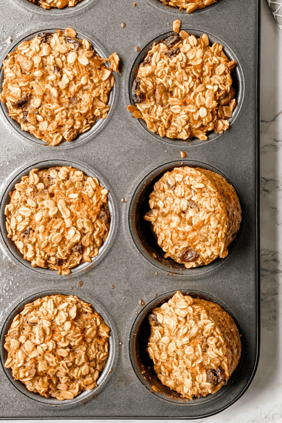 baked oatmeal cups in a muffin pan.