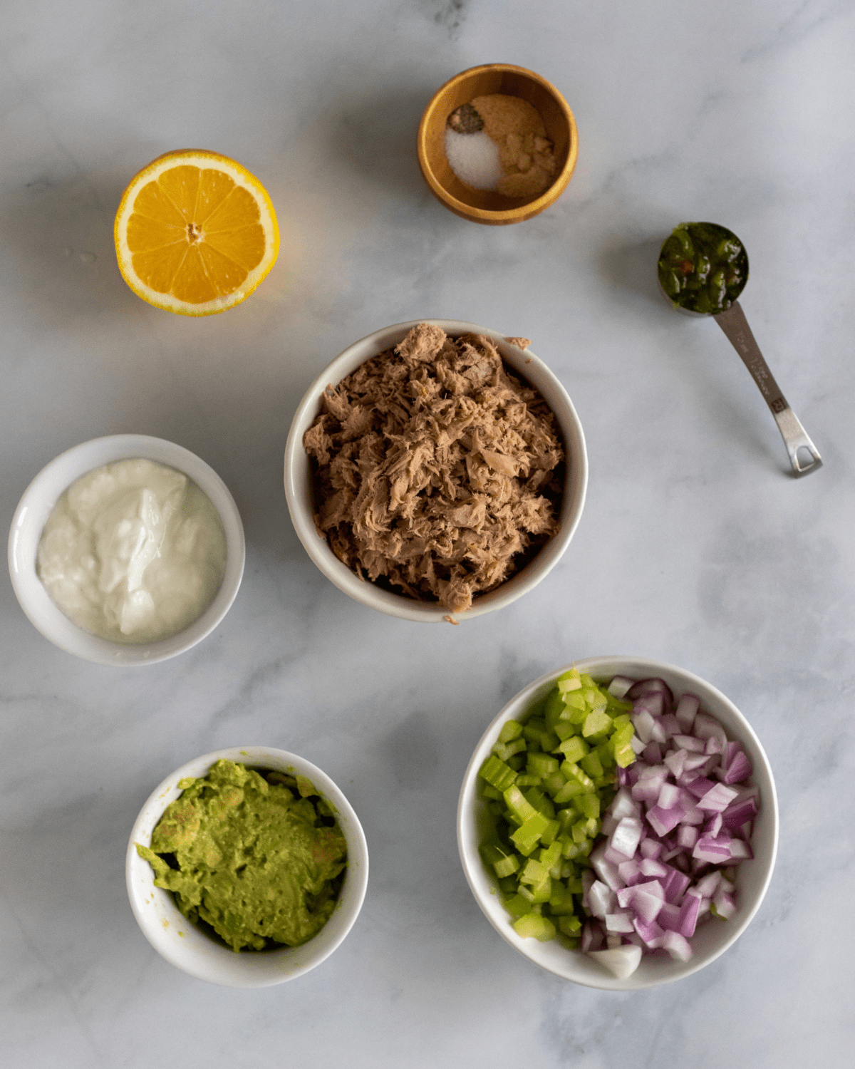 healthy tuna salad ingredients. Canned albacore tuna, avocado, greek yogurt, seasonings. relish, celery and onions, and lemon. No mayo in this recipe.