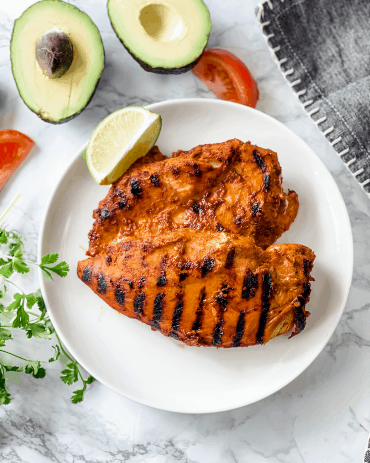 two pieces of grilled chipotle marinade chicken breasts.