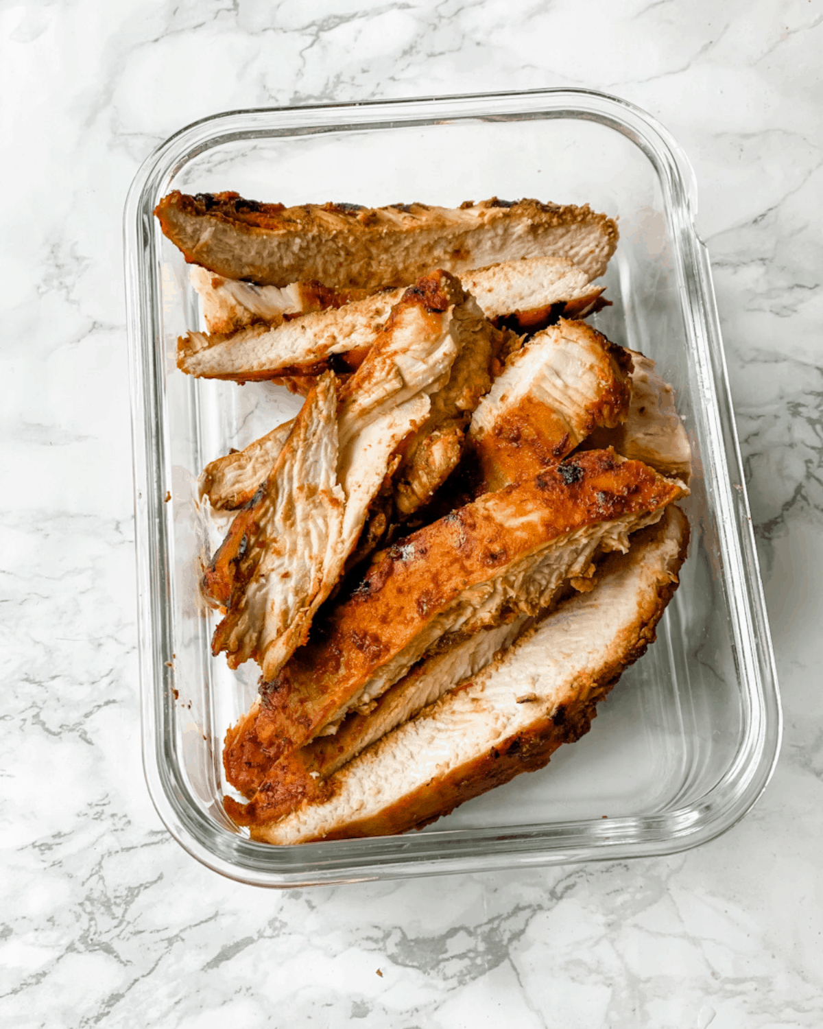 cooked chicken in a meal prep container