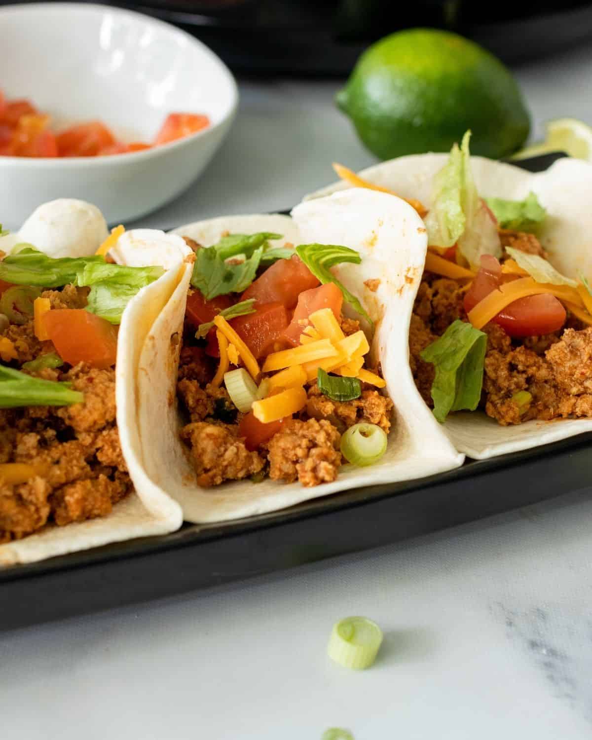 turkey soft shell tacos in a platter