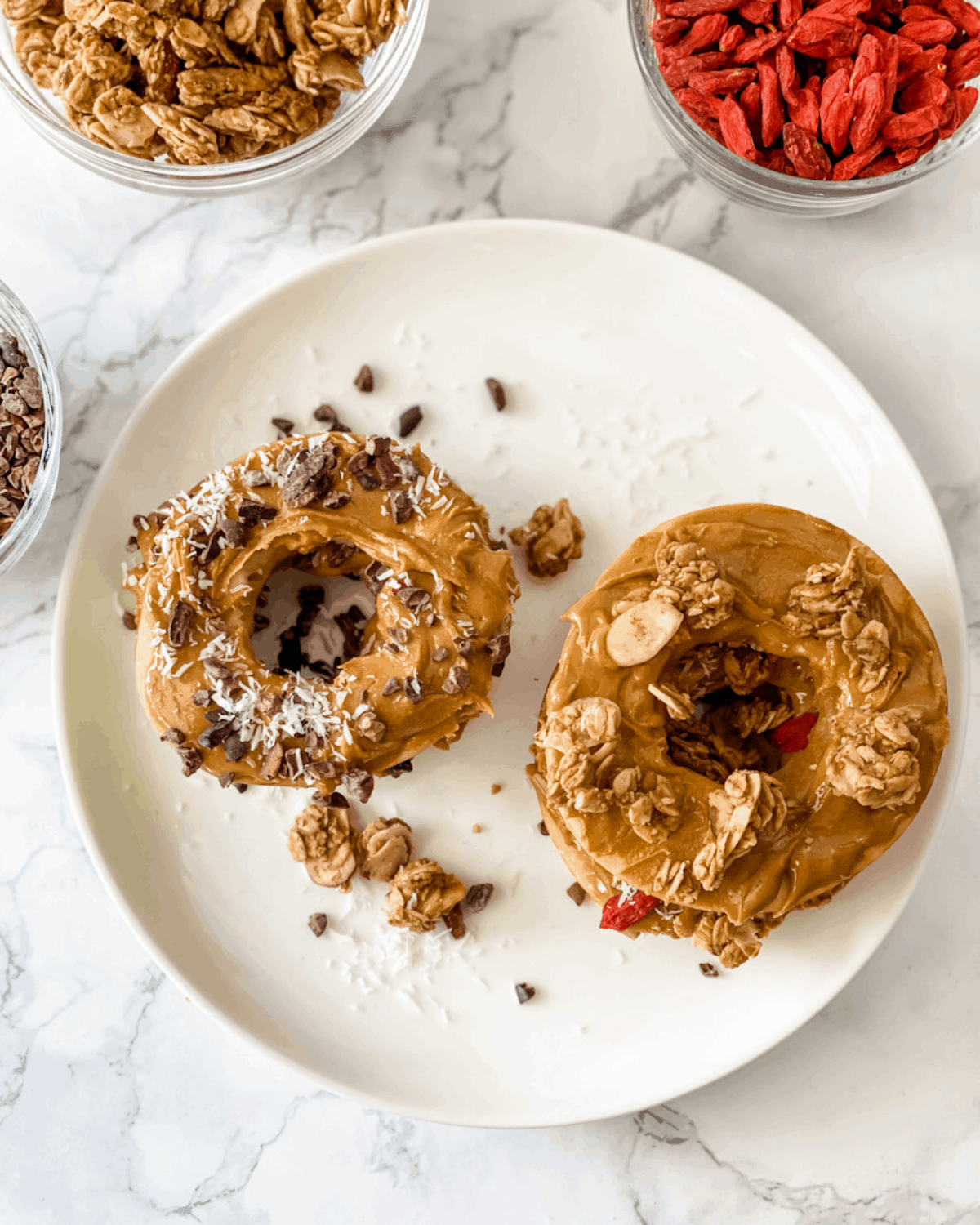 apple sandwiches with peanut butter, granola, and other toppings.