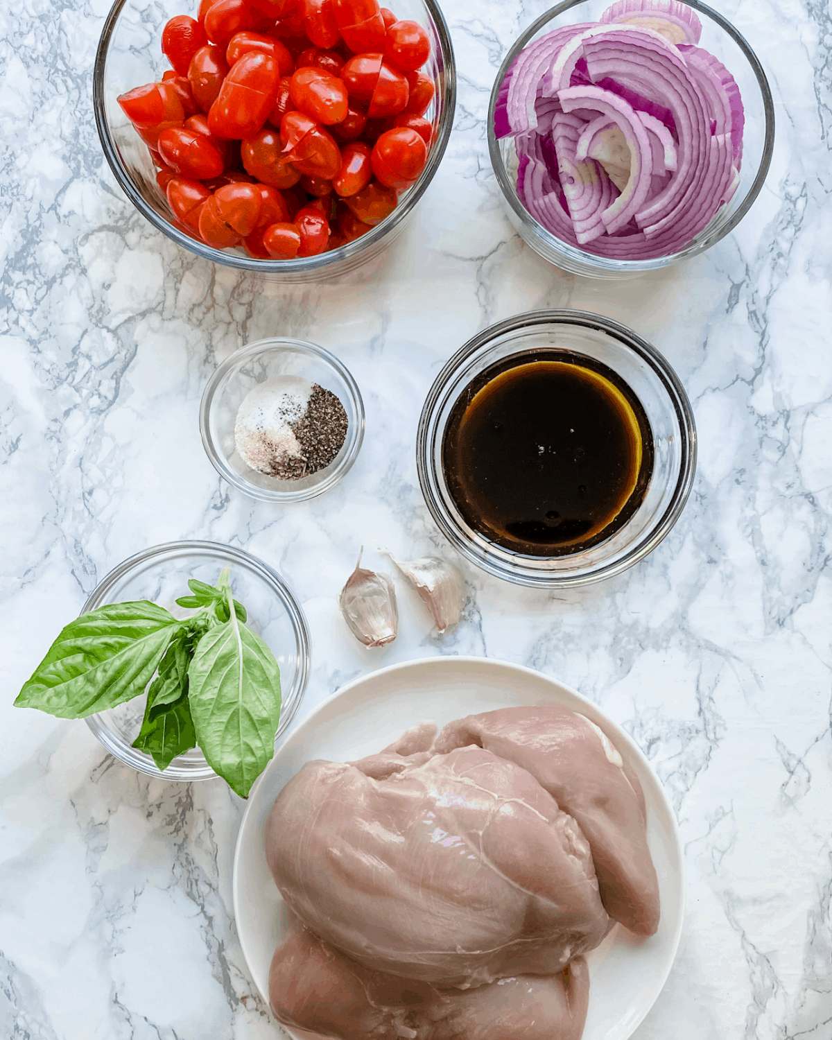 The ingredients to make bruschetta chicken baked in the oven