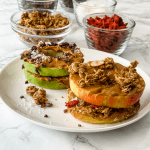 apple sandwich with peanut butter and granola