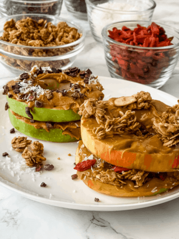 apple sandwich with peanut butter and granola