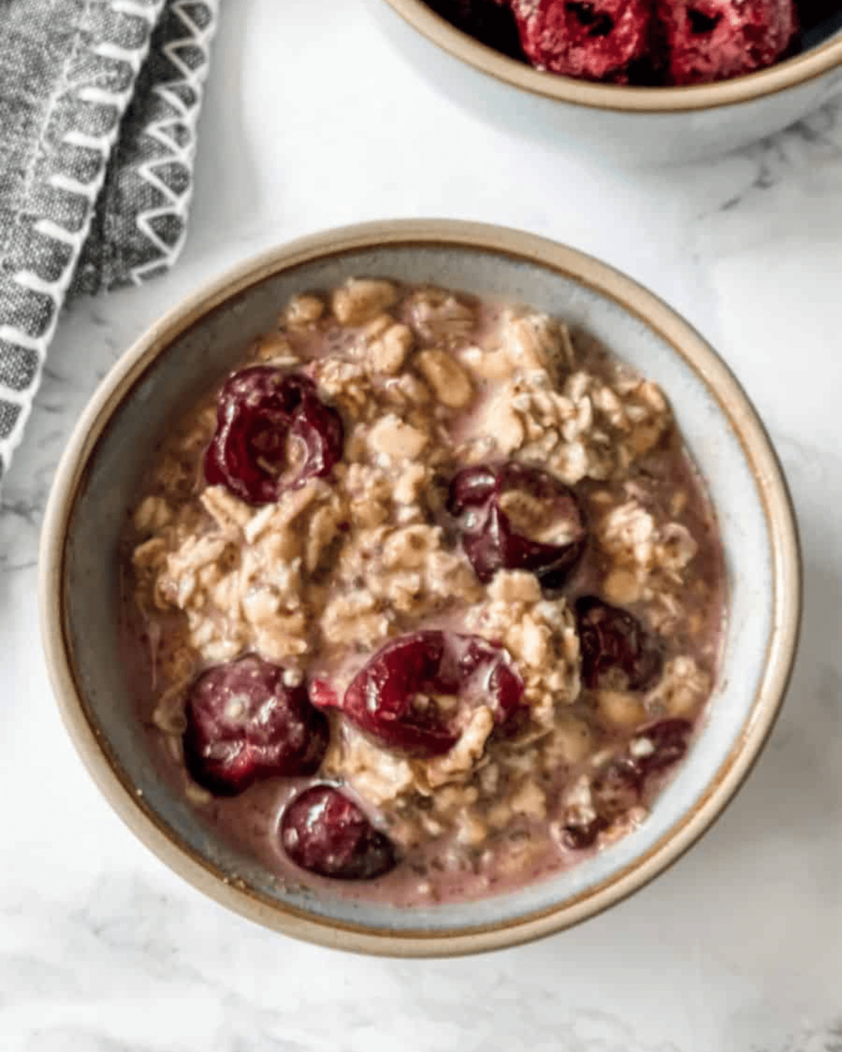 overhead view of cherry overnight oats in a bowl.
