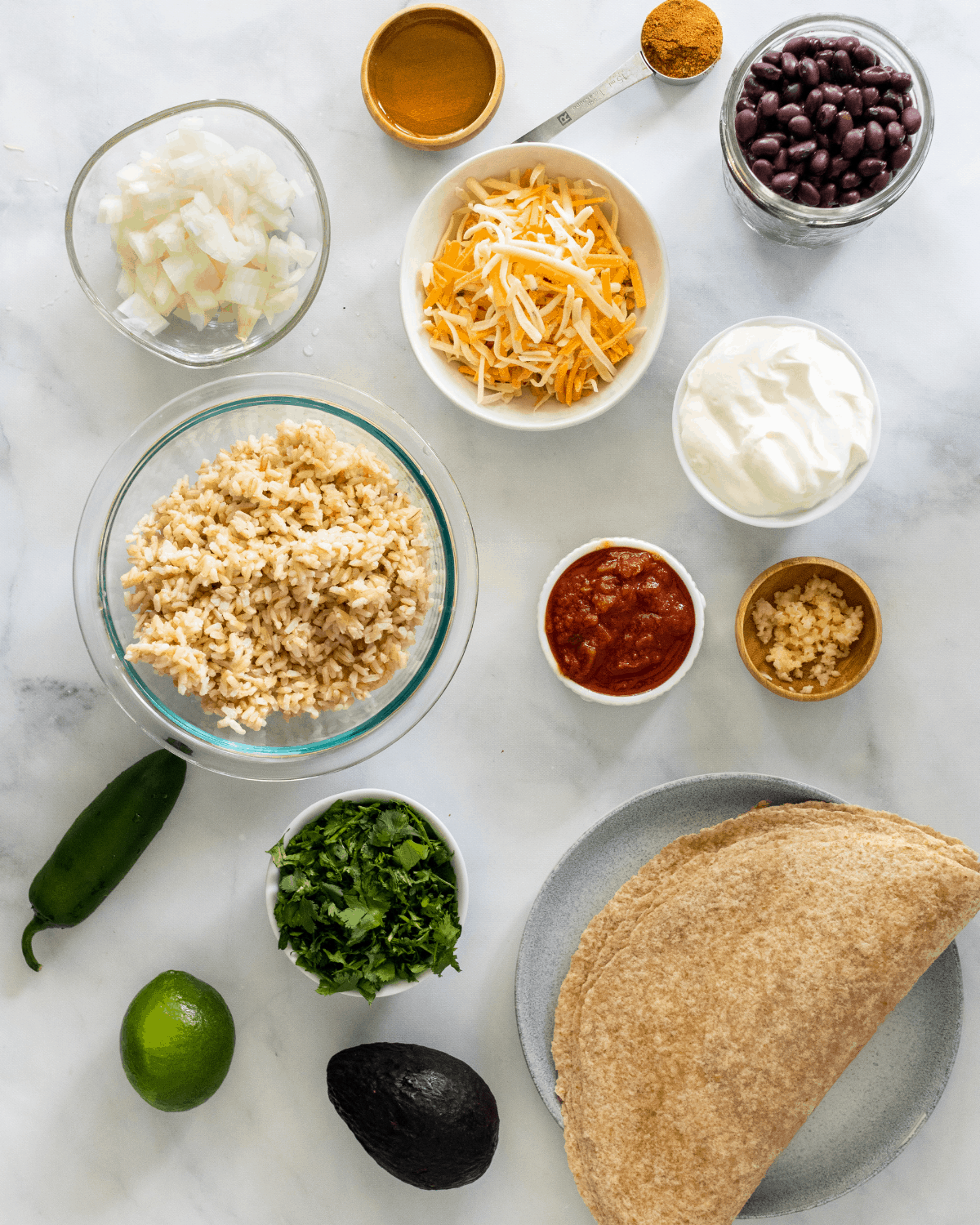 All of the ingredients to make vegetarian burritos.