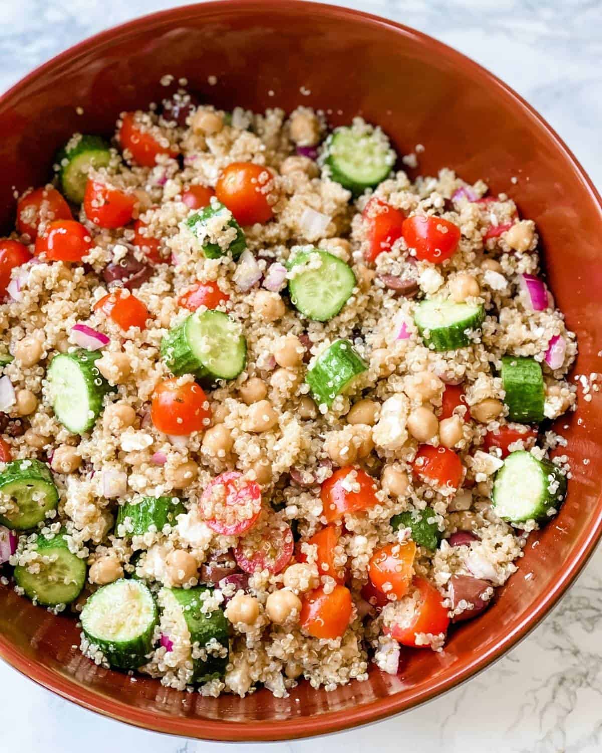 green quinoa salad in a large salad bowl.