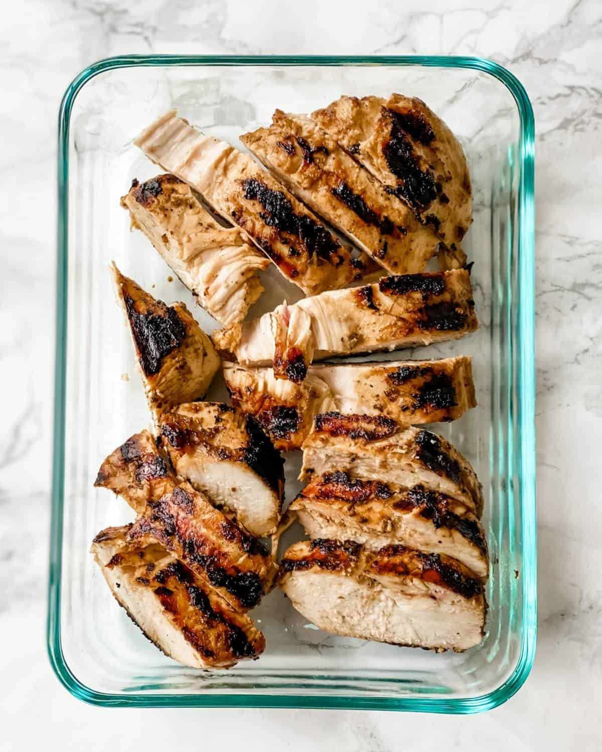 sliced chicken in a glass container