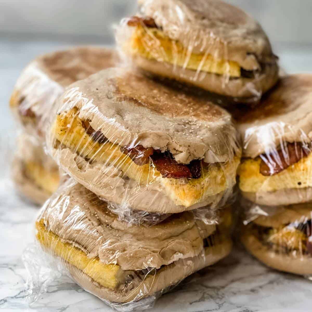 frozen breakfast sandwiches wrapped in plastic wrap.